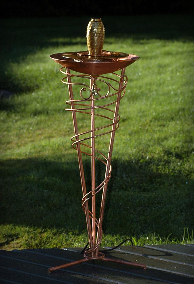 Made from copper tubing, a hand spun copper bowl and repurposed brass.